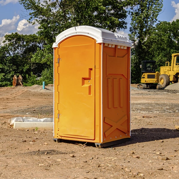 what is the cost difference between standard and deluxe portable restroom rentals in Mitchell County